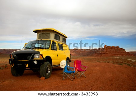 Camping with Yellow RV Van in Valley of Gods, Utah