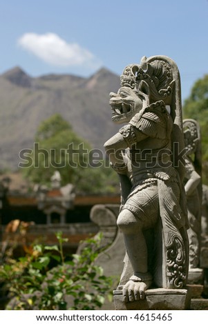 Balinese statue and volcano Bali Indonesia Balinese statue and volcano Bali Indonesia