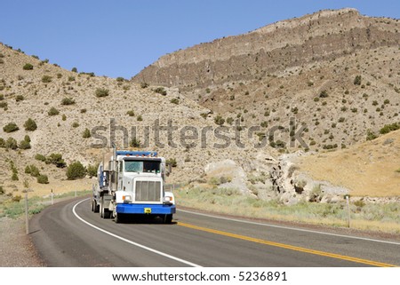 Semi truck on Deserted highway in high mountains, Utah