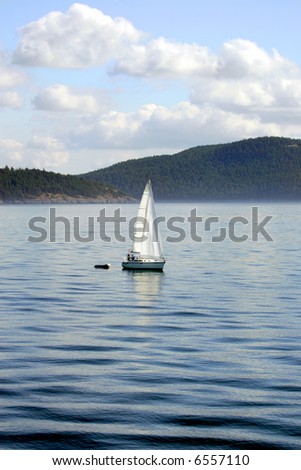 Sailing boat on calm ocean waters