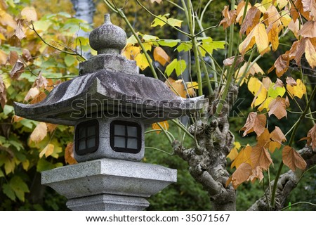 Stone lantern in Japanese Garden in autumn, Kyoto, Japan