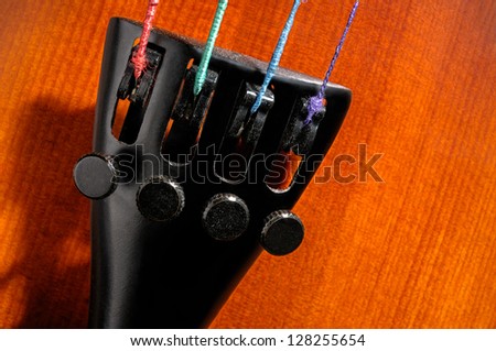 Violin tailpiece with fine tuners and strings closeup