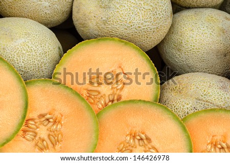 Cantaloupe melon pieces on a weekly fruit market
