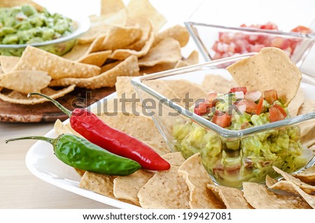 Guacamole with corn tortilla chips and chili