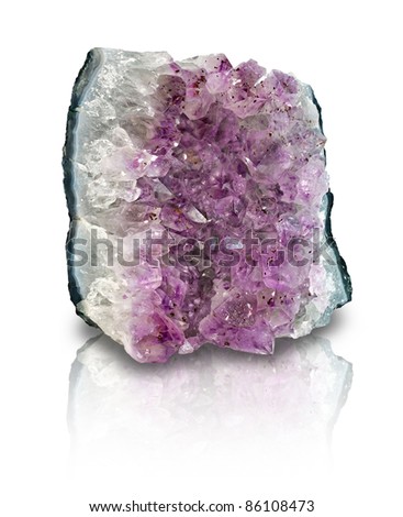 Slab of amethyst geode on white background with reflection. Amethyst is a protective and spiritual stone that is used to open your awareness of your higher self.