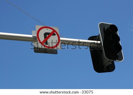 Traffic lights and no right turn sign.