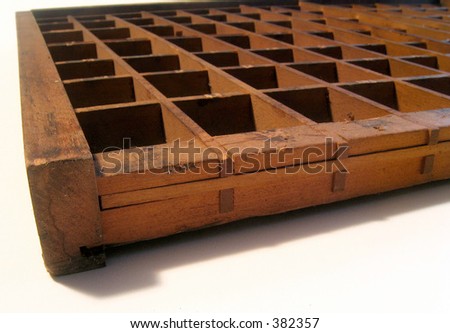 Perspective/close-up of a type tray drawer or shadow box.