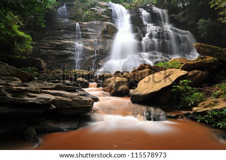 Waterfall in spring season located in deep rain forest jungle. Mae Tad Waterfall, Chiang Mai, Thailand.