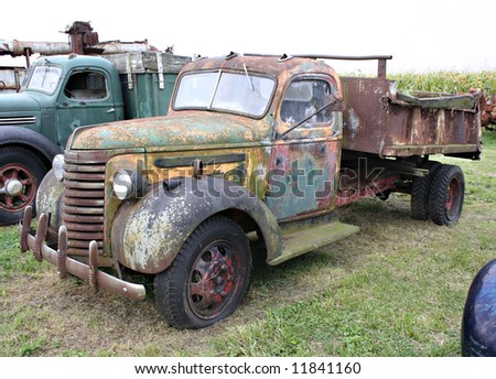 A side view of an old farm truck