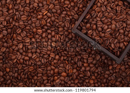 Wooden chest with coffee beans. Focus on coffee beans in a chest