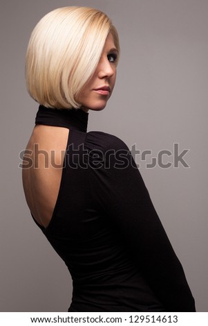 Fashionable elegant woman with short blond hairstyle