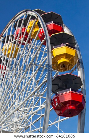 Close-up of Colorful Ferris Wheel on Vivid Blue California Sky Background