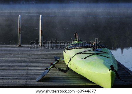 Green kayak on dock/ Misty Water Morning/ Cool autumn morning awaits kayak adventure