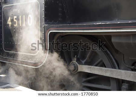 Steam rising from a steam engine.