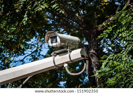 A security camera keeps an eye on the public.