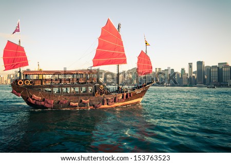 HONG KONG, CHINA - DECEMBER 28: A traditional junk ship sails through Victoria Harbor on December 28, 2013 in Hong Kong, China.