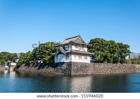 A guard tower stands across the moat at the Imperial Palace in Tokyo, Japan.