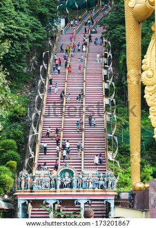Travelers climb the steps to the Batu Caves outside of Kuala Lumpur, Malaysia.