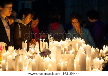 SEOUL, SOUTH KOREA - MAY 6: Buddhists light candles and pray during Buddha\'s birthday at Bongeunsa Temple on May 6, 2014 in Seoul, South Korea.