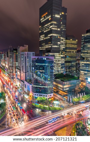 Traffic speeds through an intersection in the Gangnam district of Seoul.