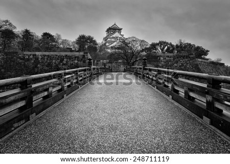 Black and white of Osaka Castle on a gloomy morning.