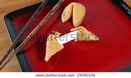 An opened fortune cookie with a blank fortune slip