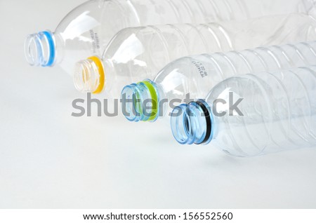 Composition with empty polycarbonate plastic bottles