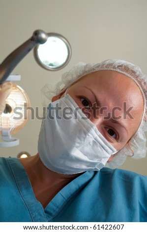 Image of female healthcare professional (doctor/nurse) wearing a surgical mask .