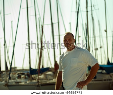 Portrait of a man on a yacht at the yacht club .