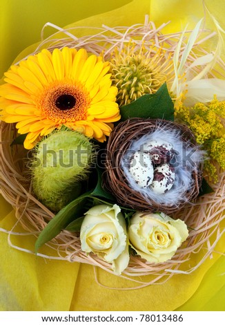 Colorful easter eggs and beautiful flowers (easter composition) .