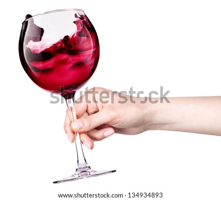 celebrate the holiday background - hand with red splashing wine making toast