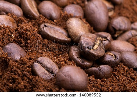 Closeup of coffee beans. Coffee bean on macro ground coffee background. Arabic coffee - ingredient of hot beverage.