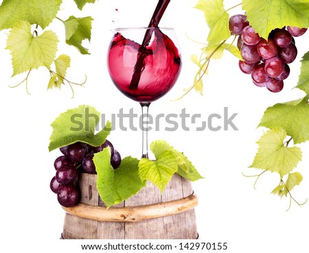 Ripe grapes and wine glass on a wooden vintage barrel isolated on a white background