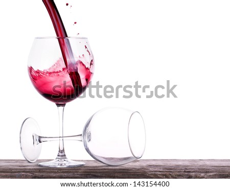 pair of full and empty wine glasses on a wooden table isolated on white