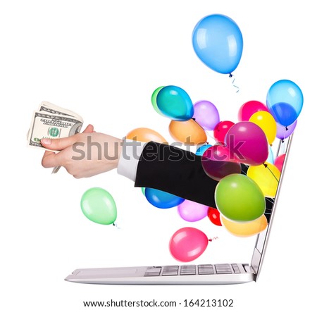 hand with money and balloons come out from a screen of a laptop computer isolated on white background
