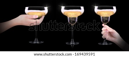 hand making toast with champagne glass on black background