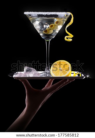Cocktail martini with waiter hand and tray on a black party background