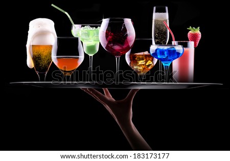 different alcohol drinks set on a tray  - beer, wine, cocktail,juice, champagne, scotch, soda