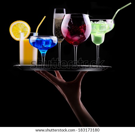 different alcohol drinks set on a tray  - beer, wine, cocktail,juice, champagne, scotch, soda