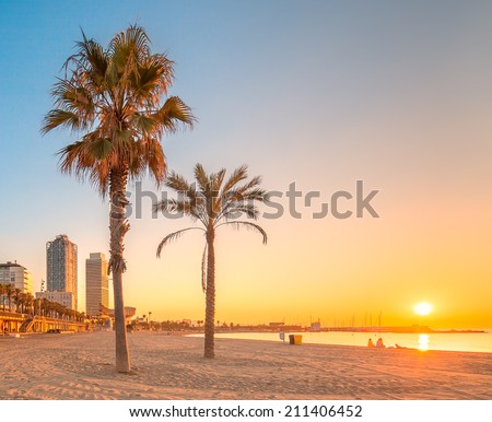 Barceloneta Beach in Barcelona with colorful sky at sunrise