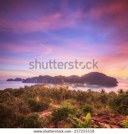 Travel vacation background - Tropical island at sunset with resorts - Phi-Phi island, Krabi Province, Thailand