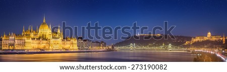 View of hungarian Parliament building and Liberty Statue at night in Budapest, Hungary