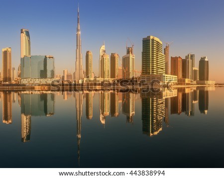 Panoramic view of Business bay and downtown area of Dubai, reflection in a river, UAE.