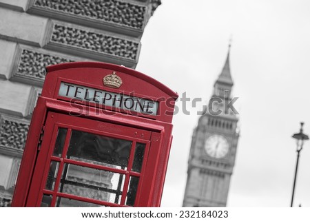 Westminster phone box in color with the Palace of Westminster in black and white in the background.