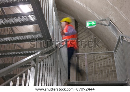 A motion blur abstract of a person walking ok the fire escape