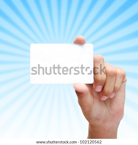 female hand hold card with blue rays background.