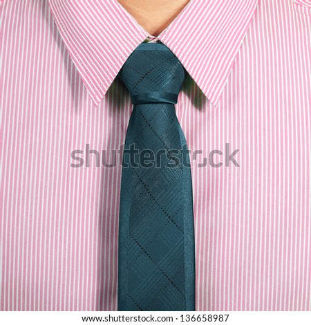 pink shirt with dark blue necktie