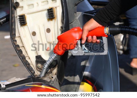 Petrol - refill fuel to motorcycle.