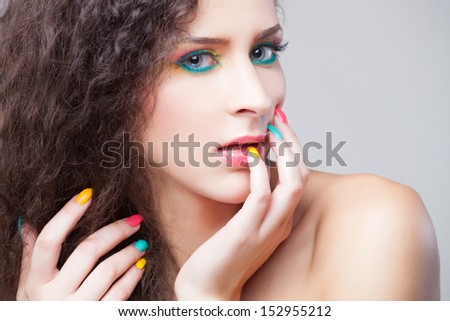 Beautiful Fashion Girl\'s Face. Make-up and Manicure.