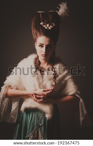 Old fashioned sexy woman with fur cape